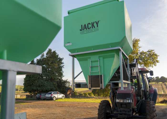 Tractor lifting Jacky® Bin for easy placement